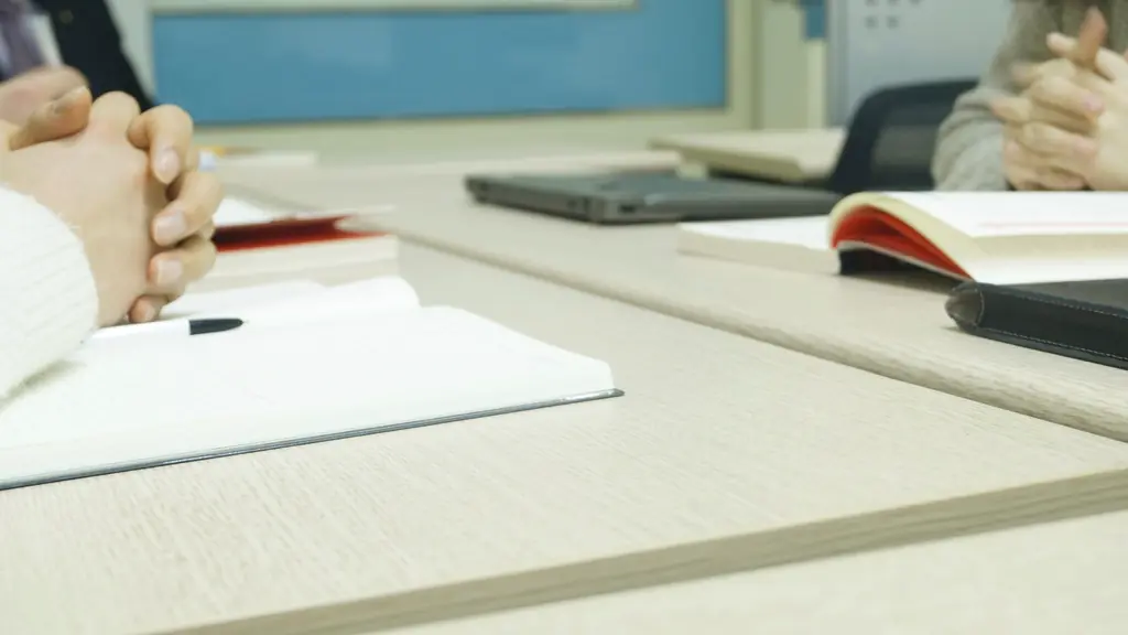 Notebooks and papers on a meeting table