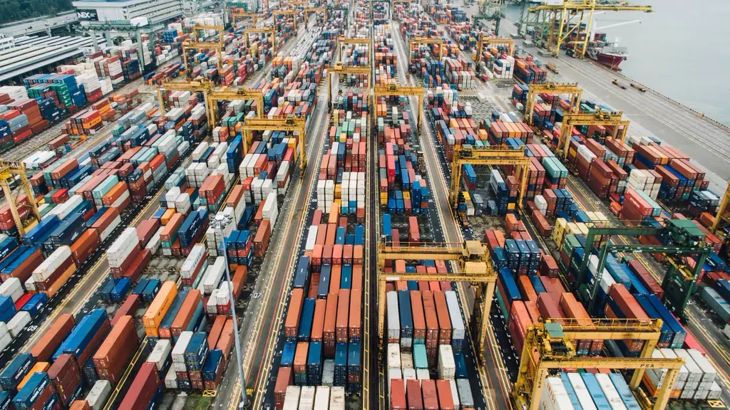 Rows of shipping containers in a terminal yard, seen from above